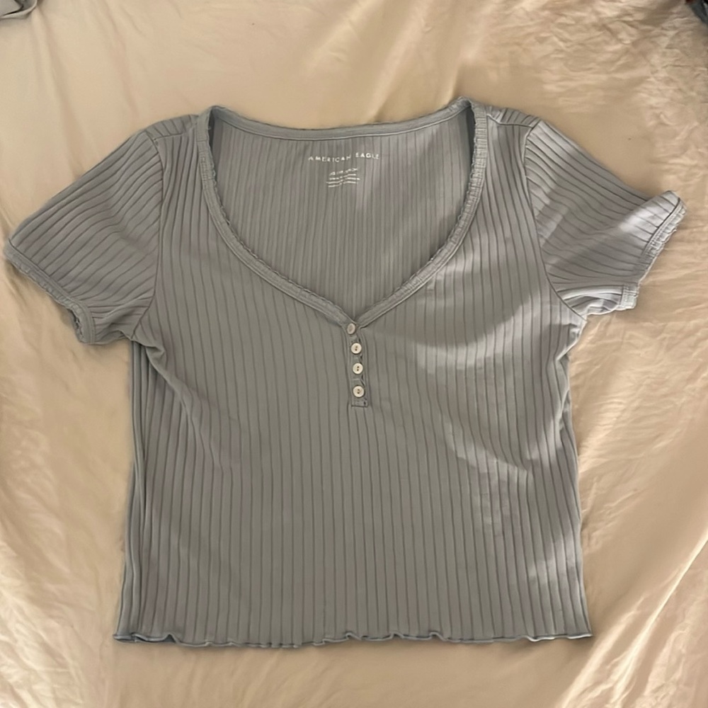 Blue/purple crop top from american eagle with buttons and ruffles on the bottom